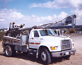 White Mobile B-53 drilling truck with boom apparatus and outrigger stabilizers